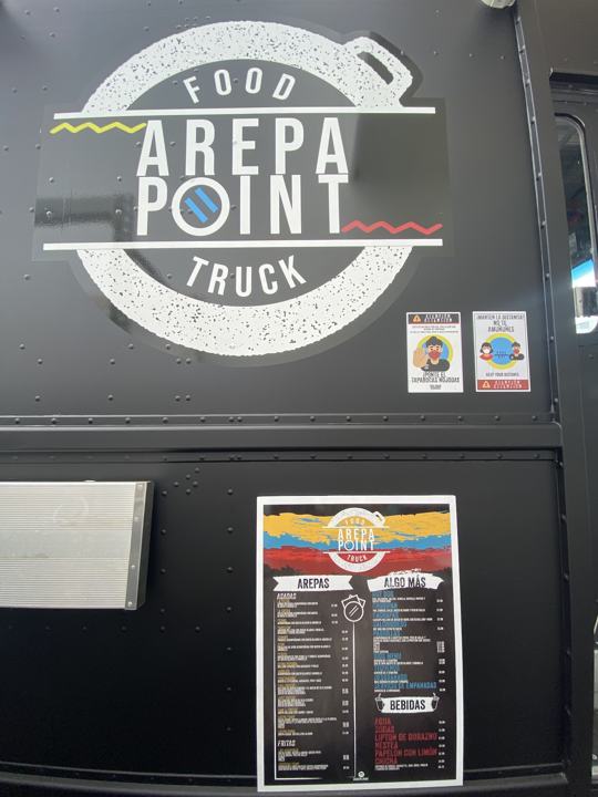 Arepa Point Food Truck logo and menu on the truck